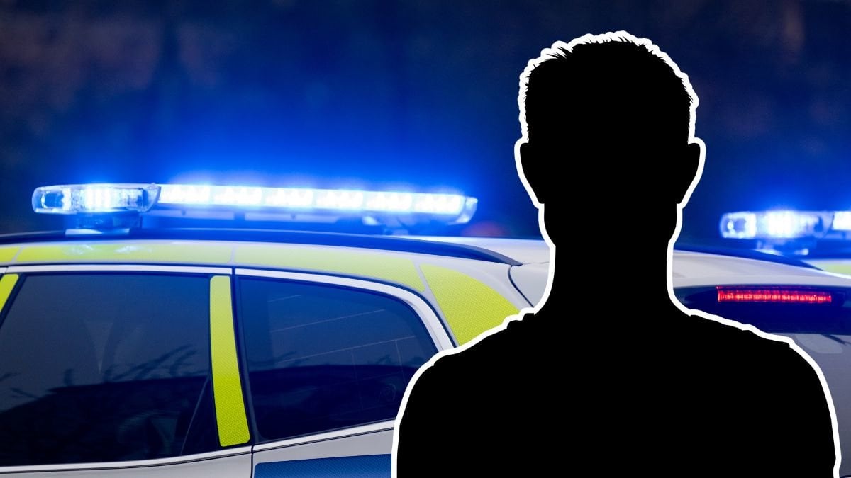 Polisbil och siluett av en man.