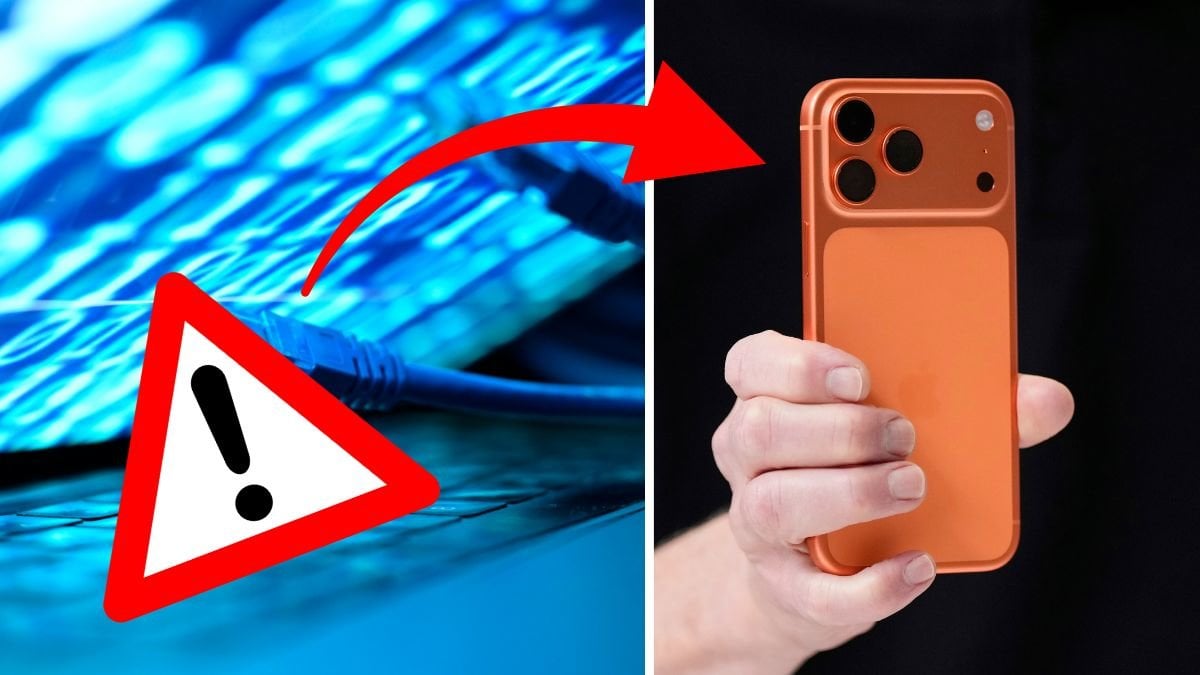 Datorskärm med kablar liggande på tangentbordet vänster. En Iphone höger. Utklippt varningsskyl vänster.t 