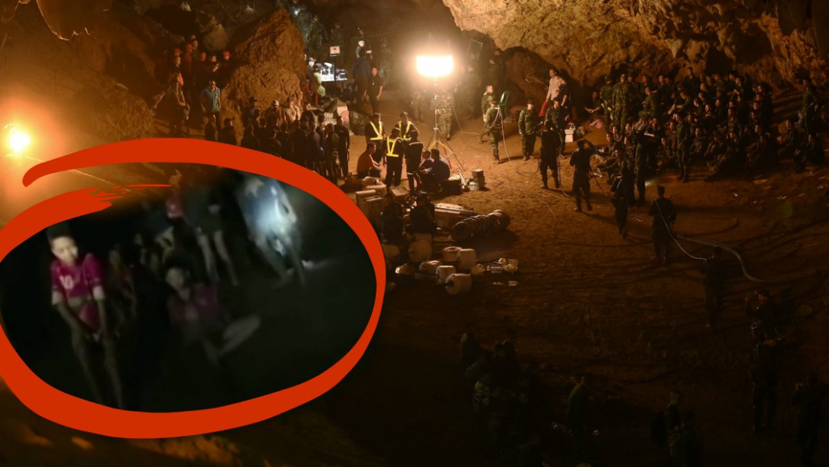 Brandmän och dykare i en grotta