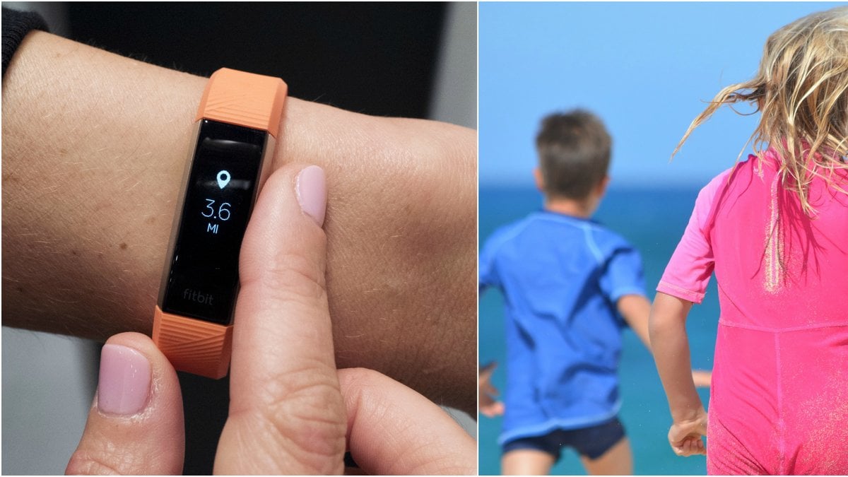 Aktivitetesmätare och barn som leker på en strand