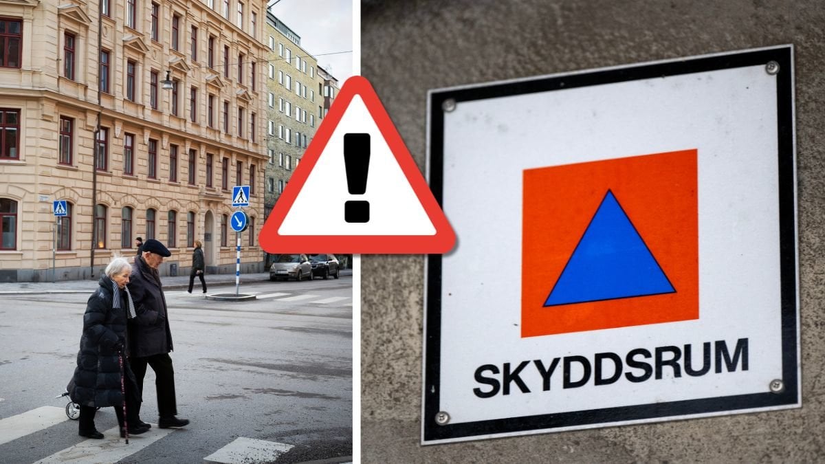 Ett äldre par och skyddsrum-skylt.
