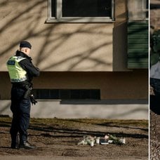 Polisman vid minnesplats och ljus.