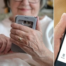 Kvinna med mobil och BankID-appen.