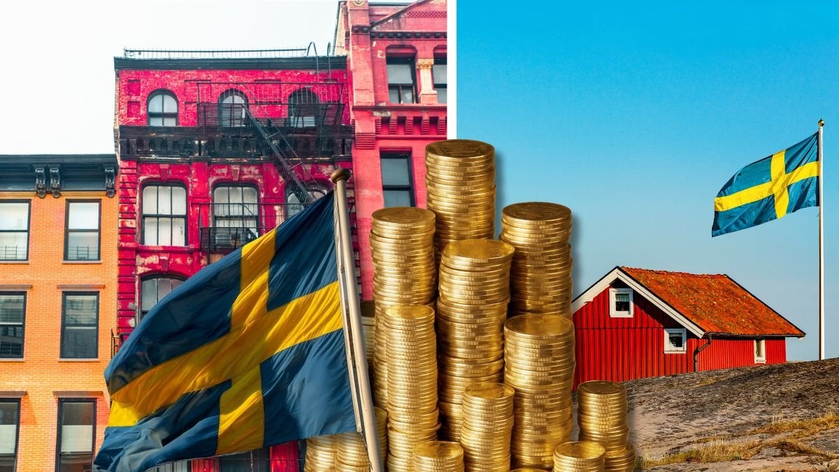 Lägenhetshus och ett hus vid vattnet. 