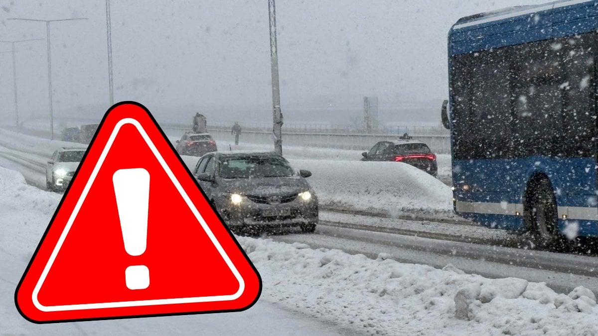 Snöfall på väg och en varningstriangel.