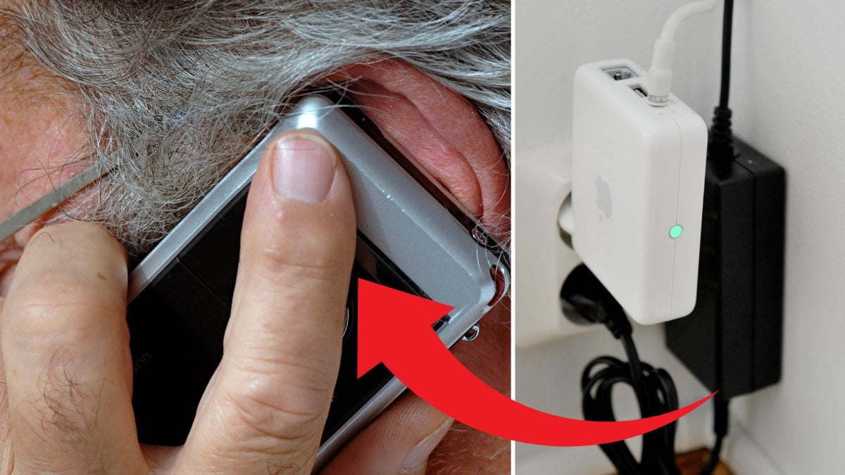 Man pratar i telefon och internet router.