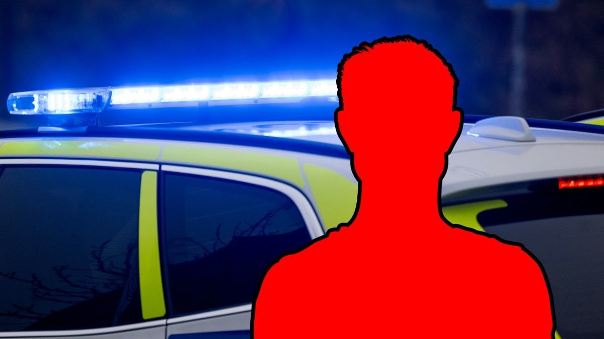 Polisbil och siluett av en man.