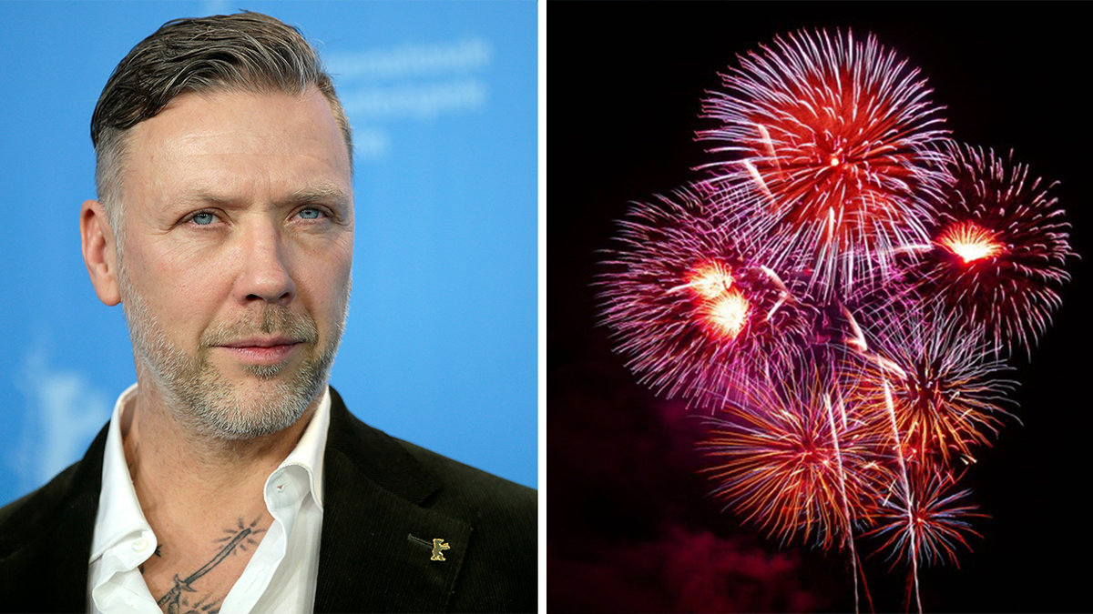 Man i kostym, röda fyrverkerier