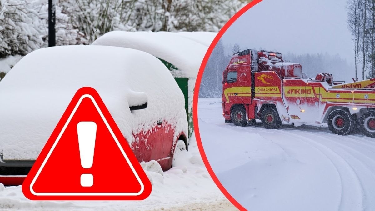 bärgningsbil och insnöad bil