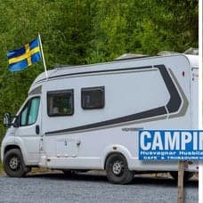 Husbil och soptunna.