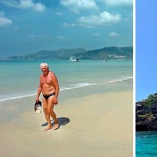 Man som går runt i Thailand på stranden och Thailands berg i vattnet.