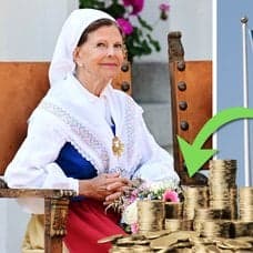 Drottningen och en Sverigeflagga.