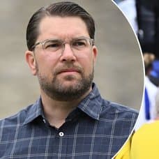 Bild på Jimmie Åkesson och en man med SD-keps.