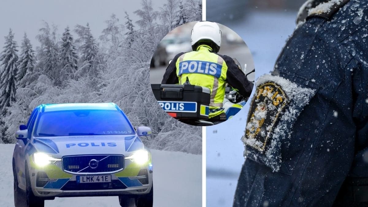Polisbil och en polis i snö.