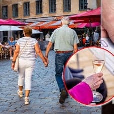 Äldre par, bubbel i glas och pengar.