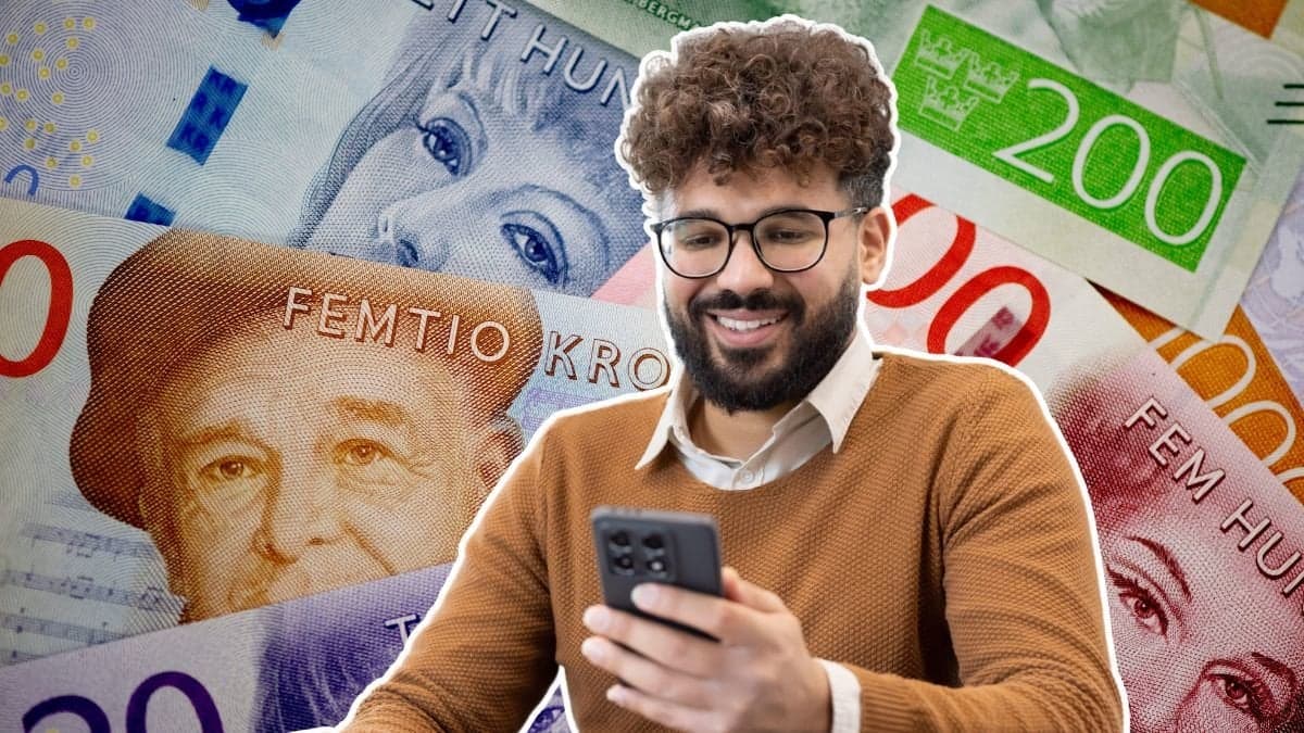 Pengar och en man med mobiltelefon i handen.