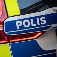 Polisbil och polis och polishund