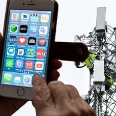 Mobiltelefon, mobilmast och 5G-mast.