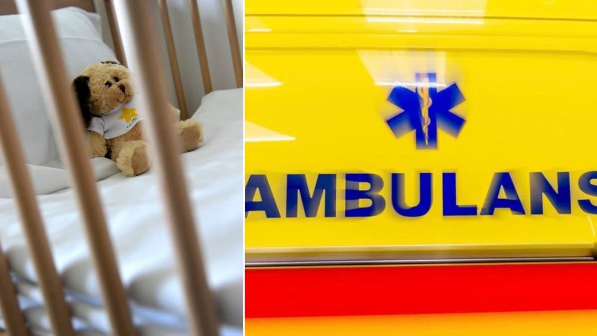 Spjälsäng med en nalle i och en ambulans.
