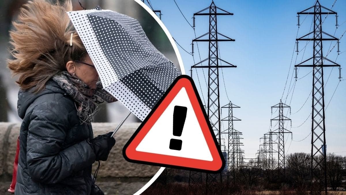 Kvinna med paraply i vind och elledningar