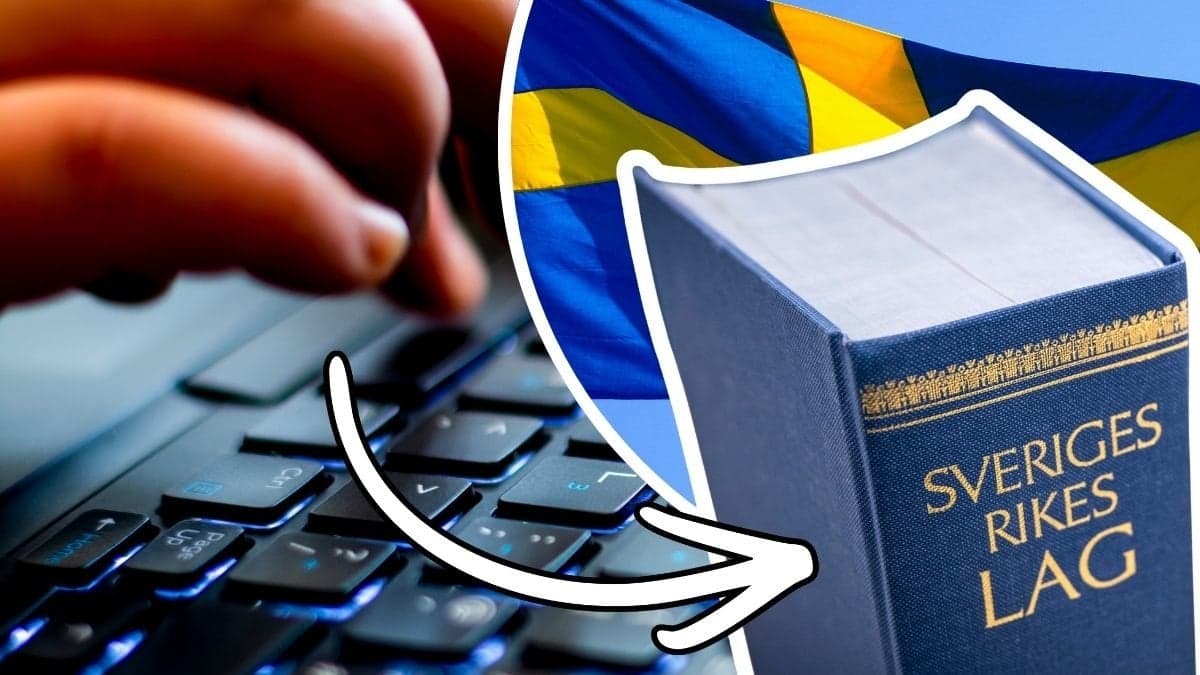 Fingrar på tangentbord, svensk lagbok och svensk flagga