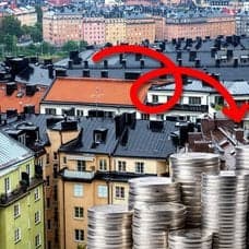 Bostadshus och sverigeflagga.