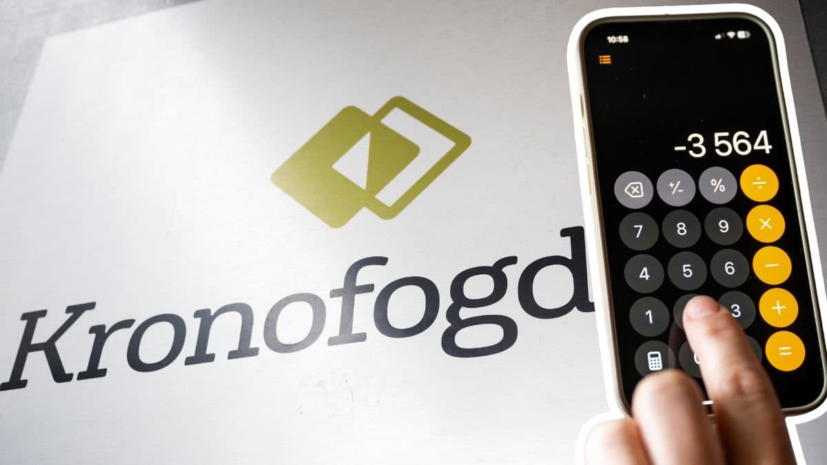 Kronofogden-skylt och en mobiltelefon med miniräknare.