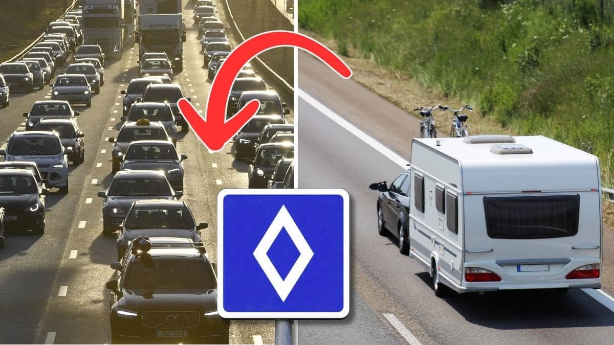 Bilväg, vägmärke och en husvagn.