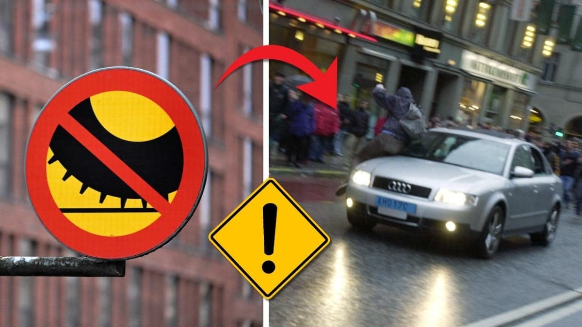 Dubbdäckförbudsskylt och bilar som kör på väg.