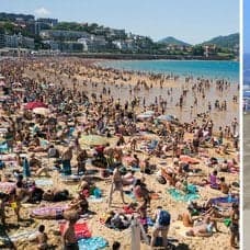 Strand i Spanien och ett solparasoll. 