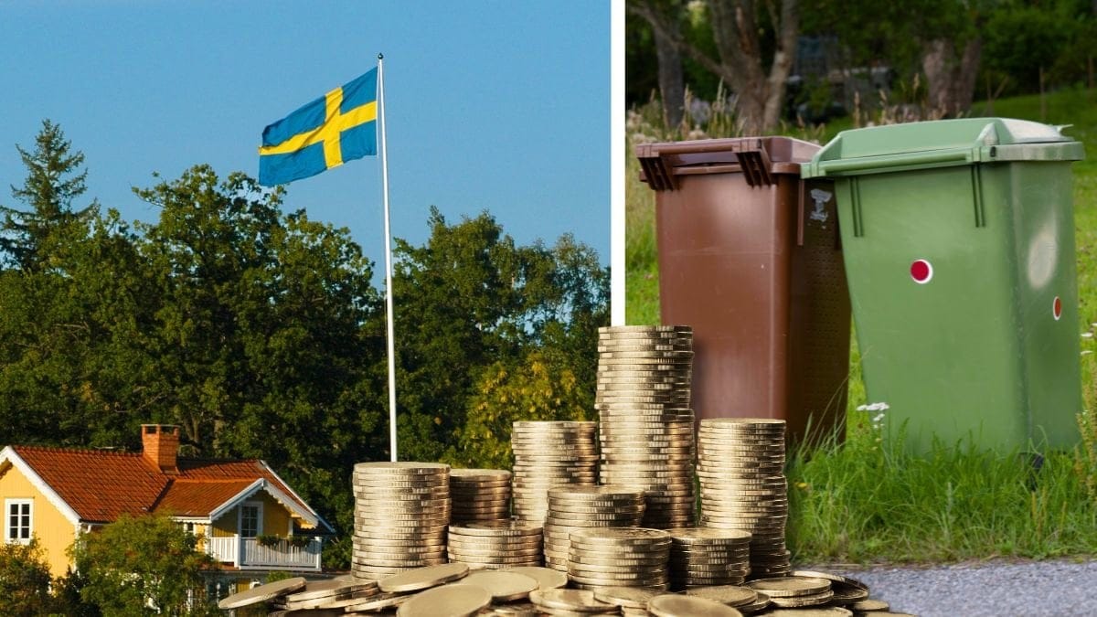 Hus med sverigeflagga och soptunnor.