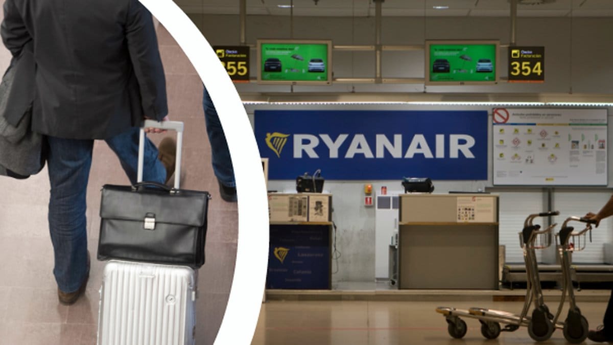 Man som går med kabinväska. Incheckning vid flygplats.