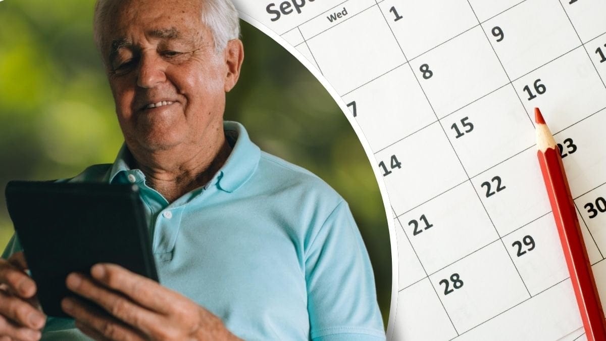 Äldre man med surfplatta och en kalender som visar september månad