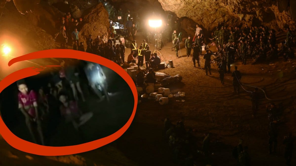 Brandmän och dykare i en grotta