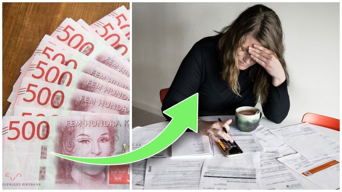 Femhundralappar på bord och en kvinna som sitter med räkningar