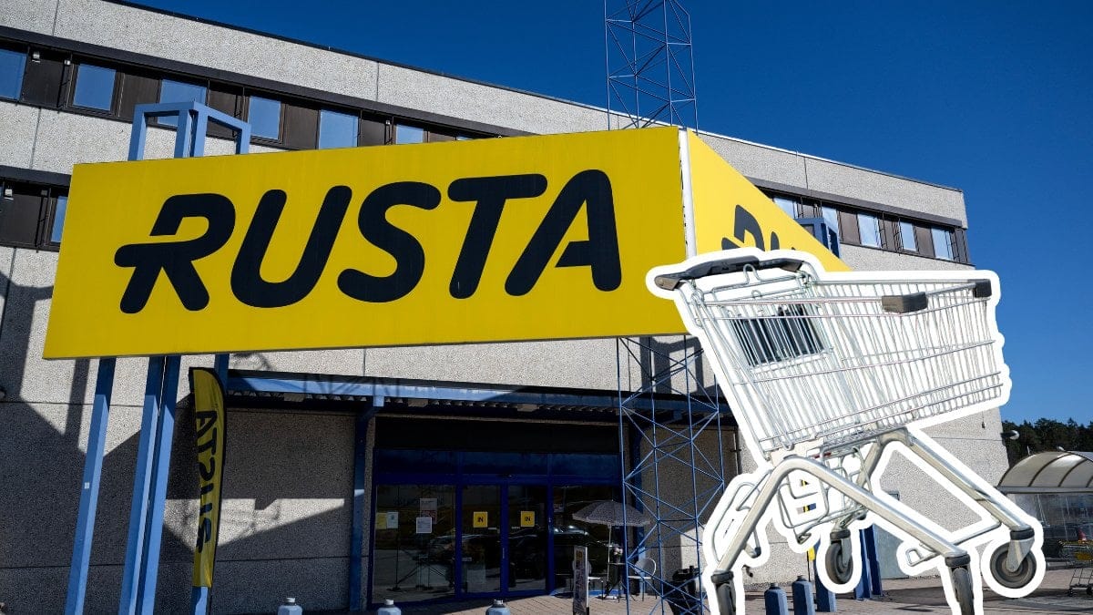 Ingång till Rusta-butik i bakgrunden. En utklippt kundvagn till höger.