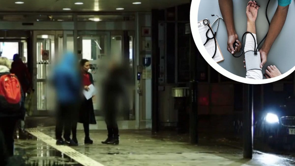Några står vid ett sjukhus. En arm får en spruta