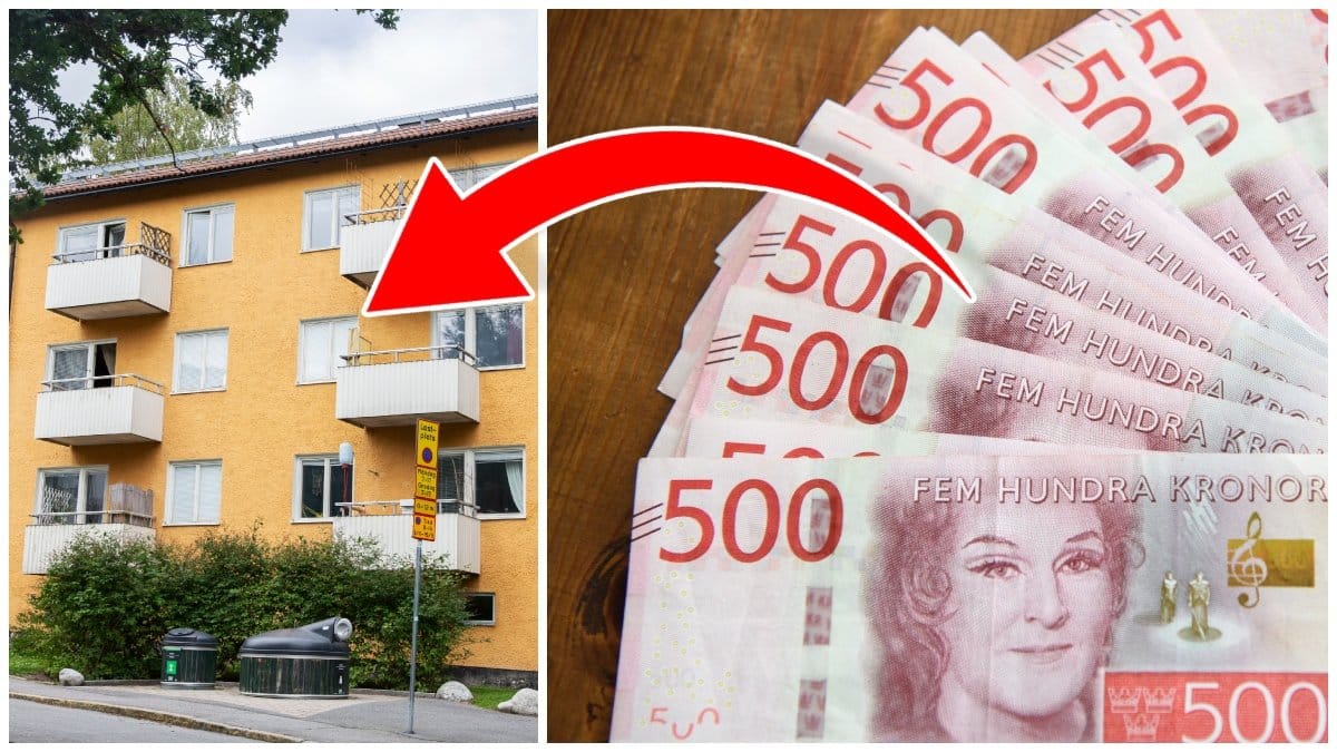 Gult lägenhetshus och femhundralappar på ett bord.
