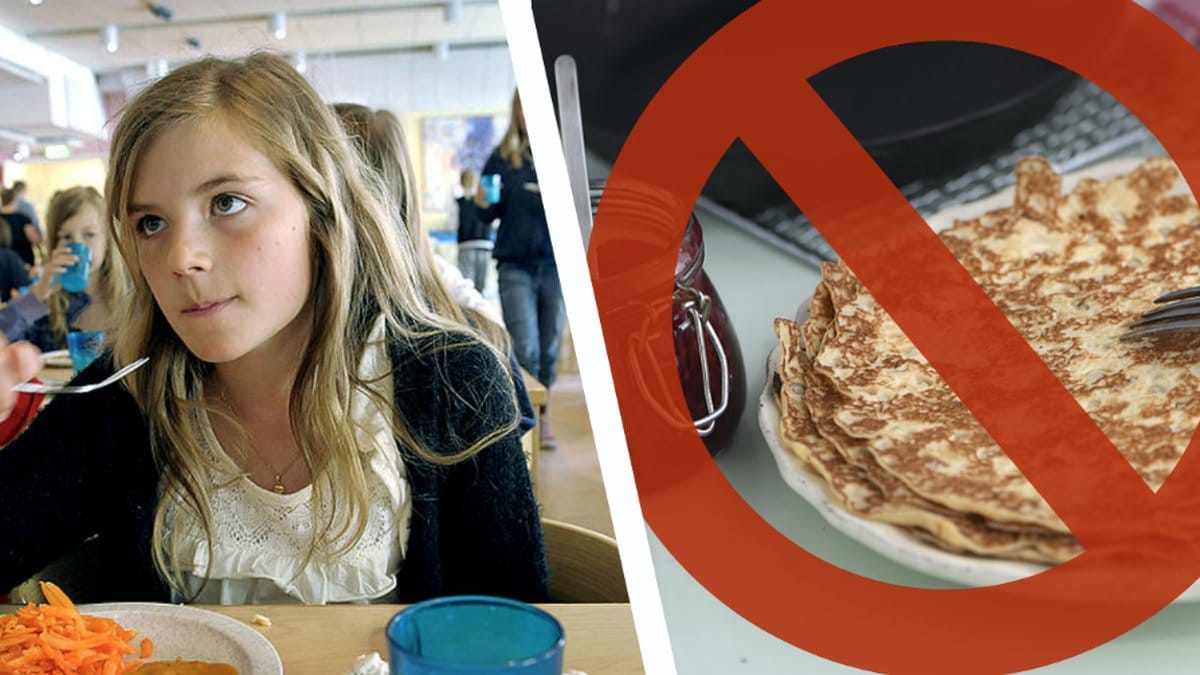 Flicka äter lunch i skolan