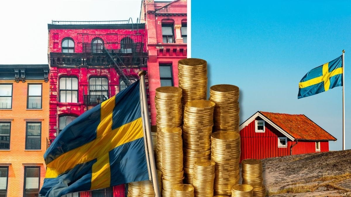 Lägenhetshus och ett hus vid vattnet.