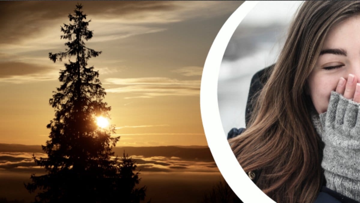 Vintersolstånd. Människa som håller händerna framför sin mun.