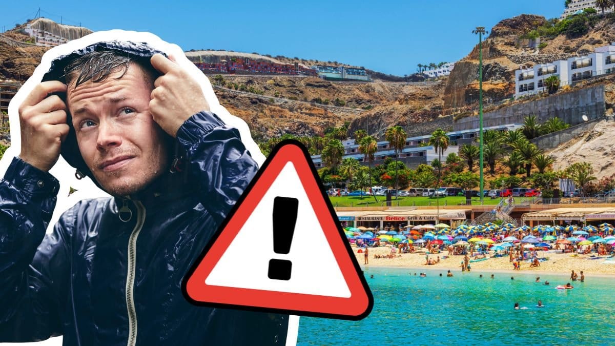 Man med blöt regnjacka och strand på Kanarieöarna