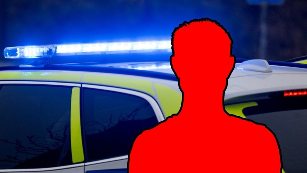 Polisbil och siluett av en man.