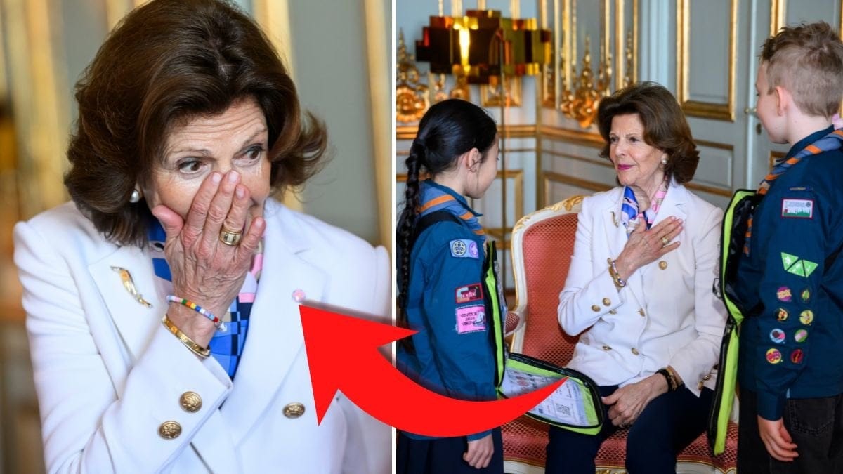 Drottningen Silvia köper majblommor.