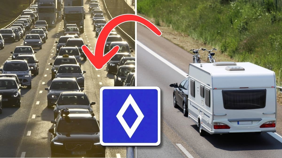 Bilväg, vägmärke och en husvagn.