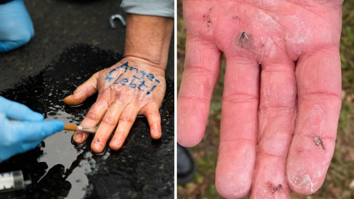 En av aktivisterna visar upp sin hand, som han limmat fast i en av körbanorna vid klimatprotesten på E4.
